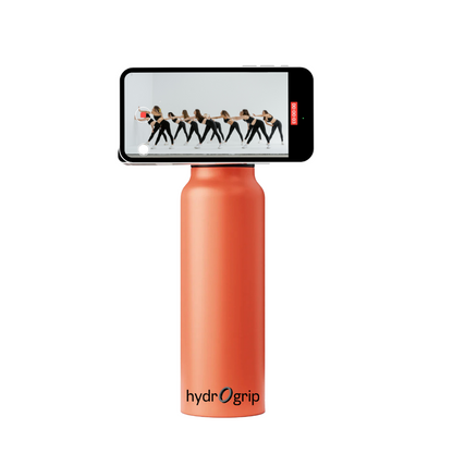 Bold orange insulated HydroGrip water bottle with MagSafe technology for phones.